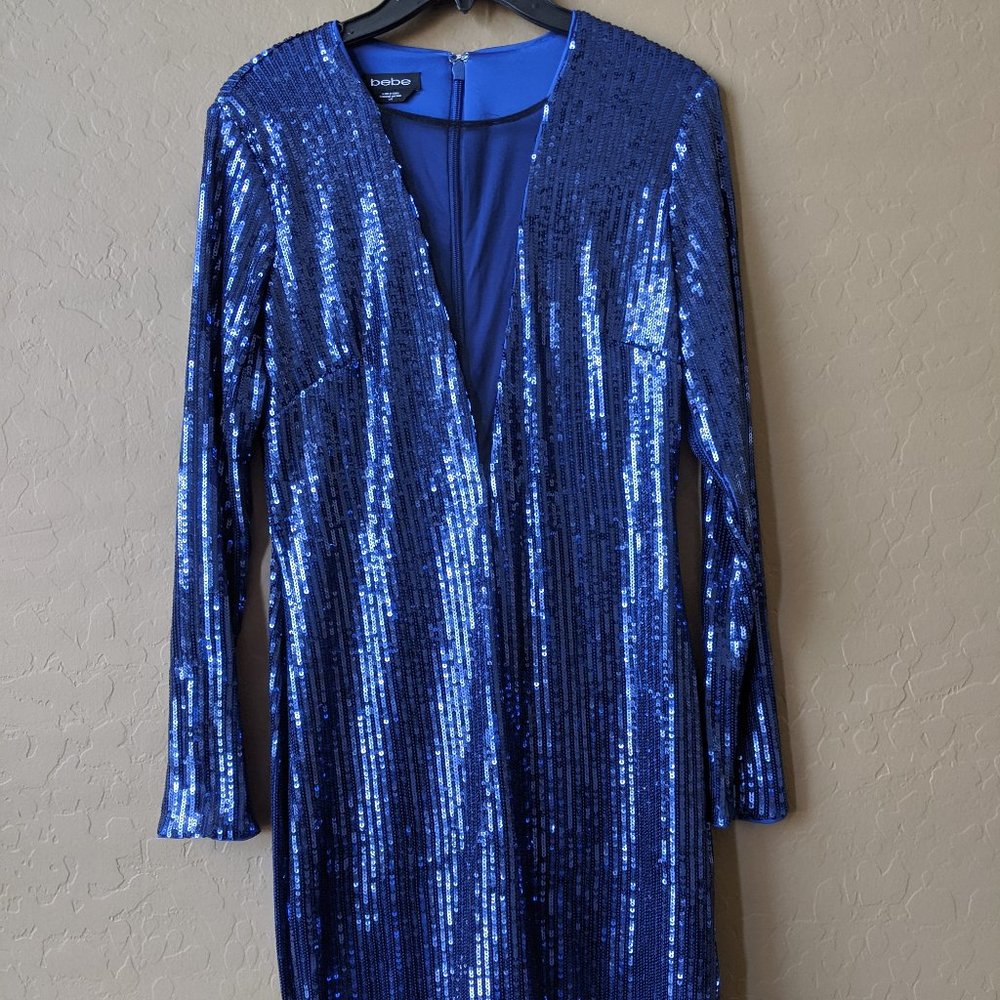 Only worn once! bebe blue sequin dress. Sex low V!